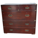 An early 20th century teak and brass bound military chest - retailed by Army & Navy, in two sections