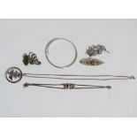 Silver jewellery - to include, three brooches, a bangle, a bracelet and a pendant necklace.