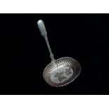 A silver caddy spoon - London 1896, Robert James Chaplin & Sons, an engraved oval bowl, weight 12g.