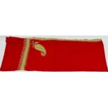 An Indian red pashmina - decorated with a paisley pattern to corners with a foliate border in gold