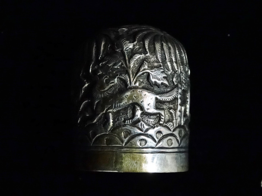 An Indian silver cylindrical box - Repousse decorated with elephants, tigers and stag in a palm - Image 5 of 7