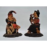 A pair of cast iron polychrome painted door stops - modelled in the form of Mr Punch, the other as