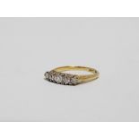 A five stone diamond dress ring - the fancy claw setting on a 18ct yellow gold band, size, weight