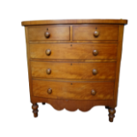 A Victorian satinwood bow front chest of drawers - with an arrangement of two short and three long