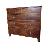A late George III mahogany chest of drawers - the rectangular top above an arrangement of two