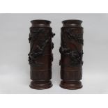 A pair of Meiji period bronze vases - extensively decorated with birds on cherry blossom, height