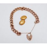 A 9ct gold curblink bracelet - with foliate engraving and a heart shaped clasp, length 16.5cm,