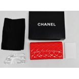 A Chanel orange quilted patent leather purse - with authenticity card, presentation box and