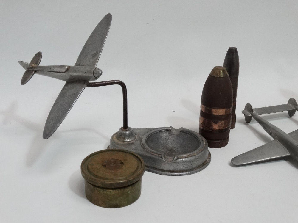 An aluminium ashtray modelled with a Spitfire swooping past - together with a trenchware bullet desk - Image 2 of 4