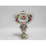 An early 20th century continental twin handled jar and cover - encrusted with roses and flowers,