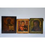Three Russian icons: Saint Nicolas with book (31x27) Mary (27x23.5) Christ (28x23.5) (*)