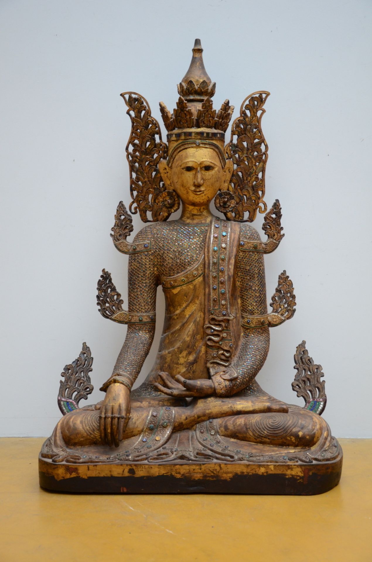 A large Burmese Buddha in wood with inlaywork, 20th century (h136cm)