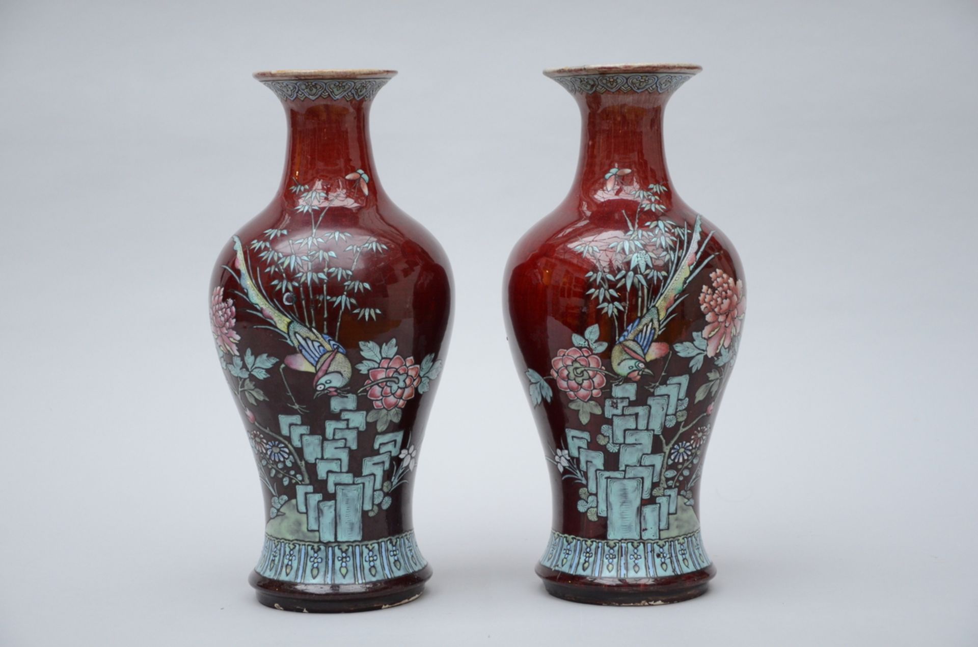 A pair of Chinese sang de boeuf vases with famille rose decoration (h 38cm) (*)