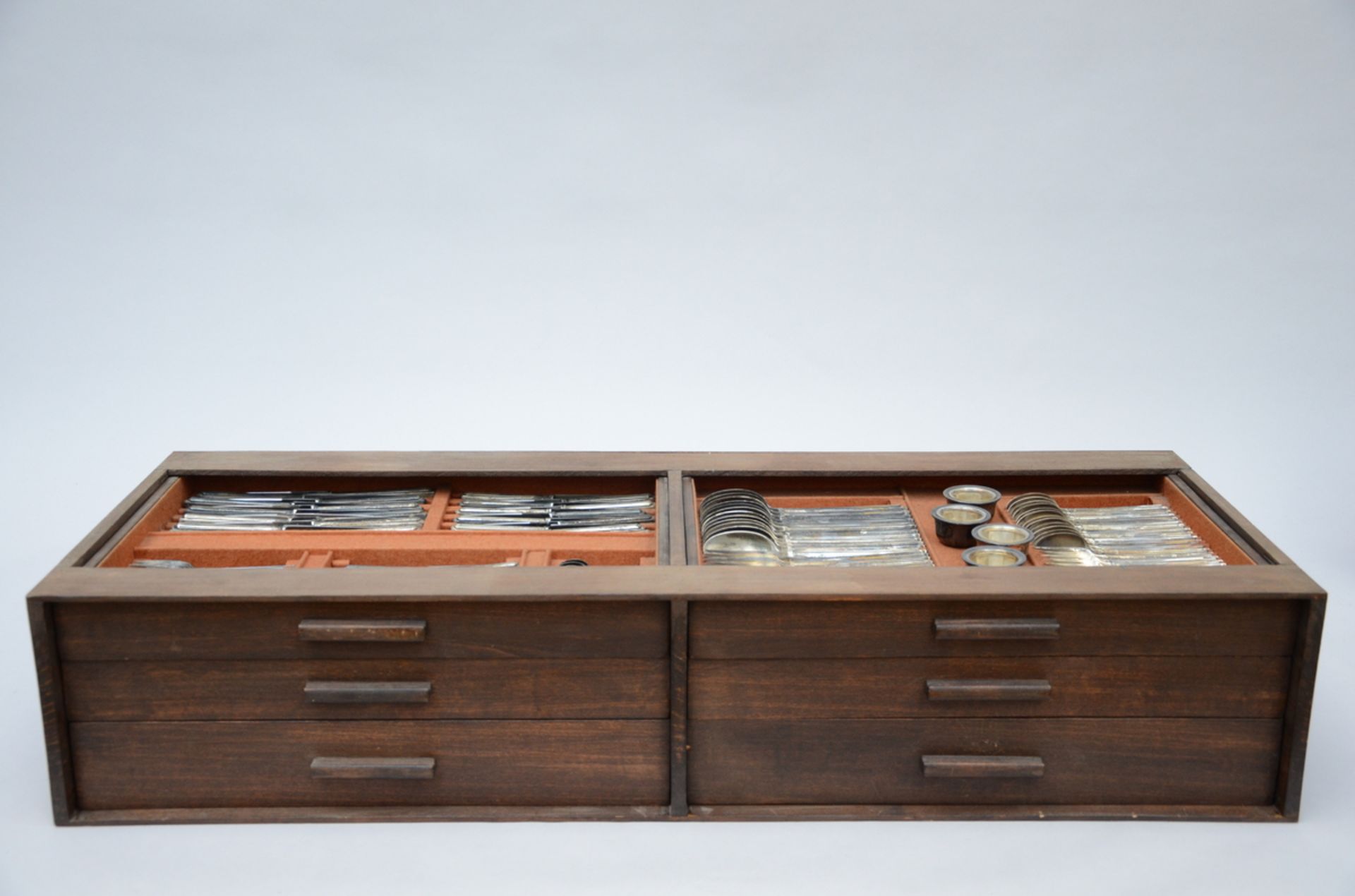 An Art Deco cutlery set in a wooden case, for 12 people