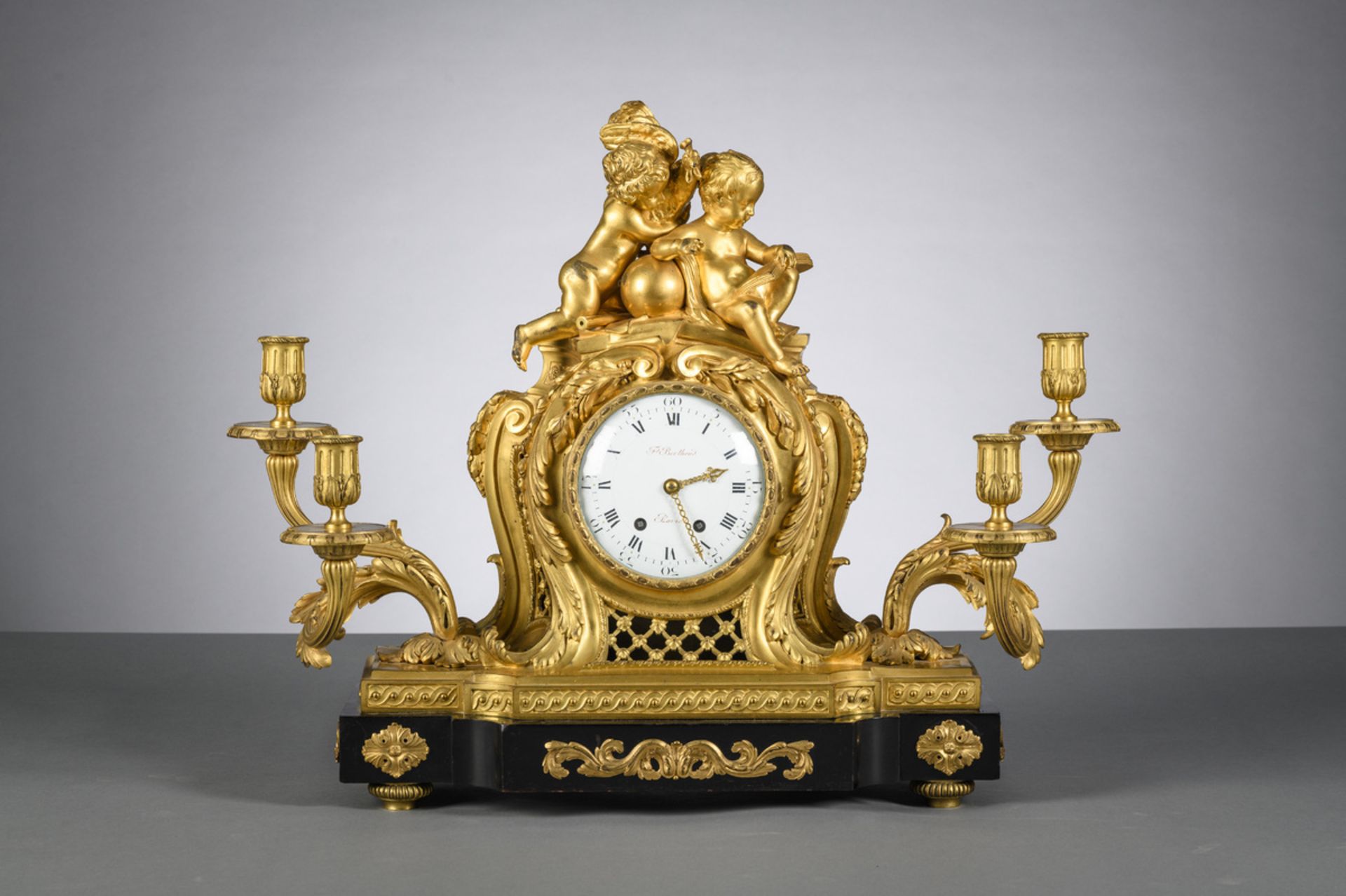 Louis XV clock in gilt bronze with wooden base, by F. Berthoud à Paris (58x71x24)