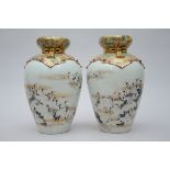 A pair of Japanese porcelain vases with relief decoration, signed (h38cm)