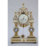 A Louis XVI clock in marble and bronze with Wedgwood plaques (33x53 x11cm)