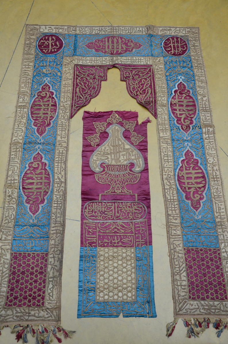 An islamic brocade with inscriptions to decorate an entrance (282x184cm)