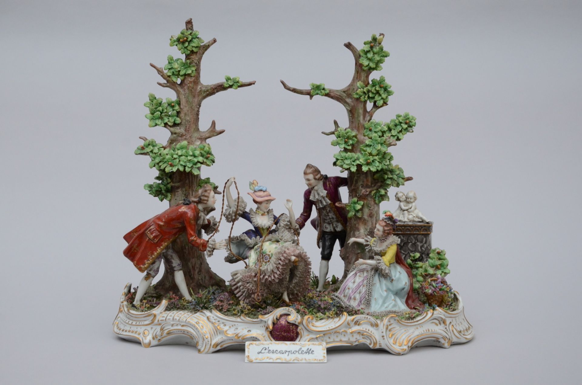 A large porcelain sculpture 'the swing' (45x48x23cm) (*)