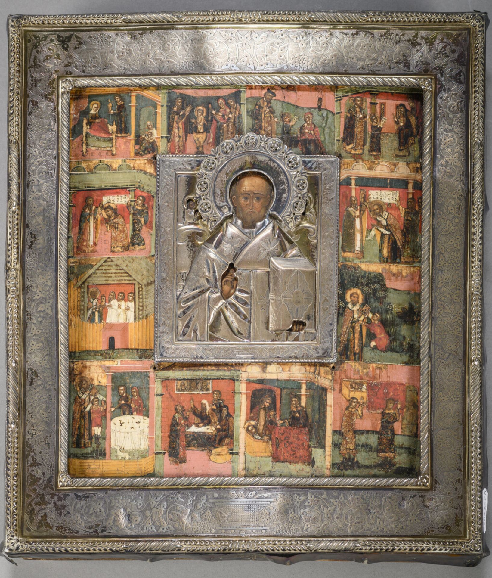 A Russian icon 'st. Nicholas' with silver riza (31x27cm) (*)