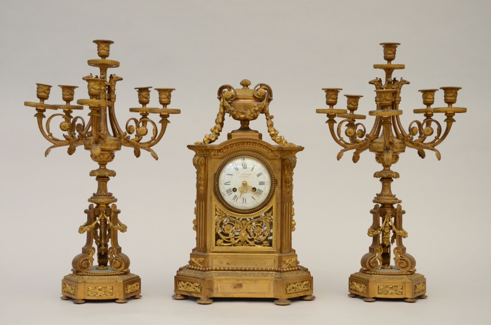 Clock set in gilt bronze, Louis XVI style (49x29x21cm) (H56cm)