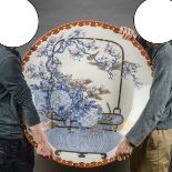 A very large Japanese porcelain plate 'flower basket', 19th century (dia 90cm)