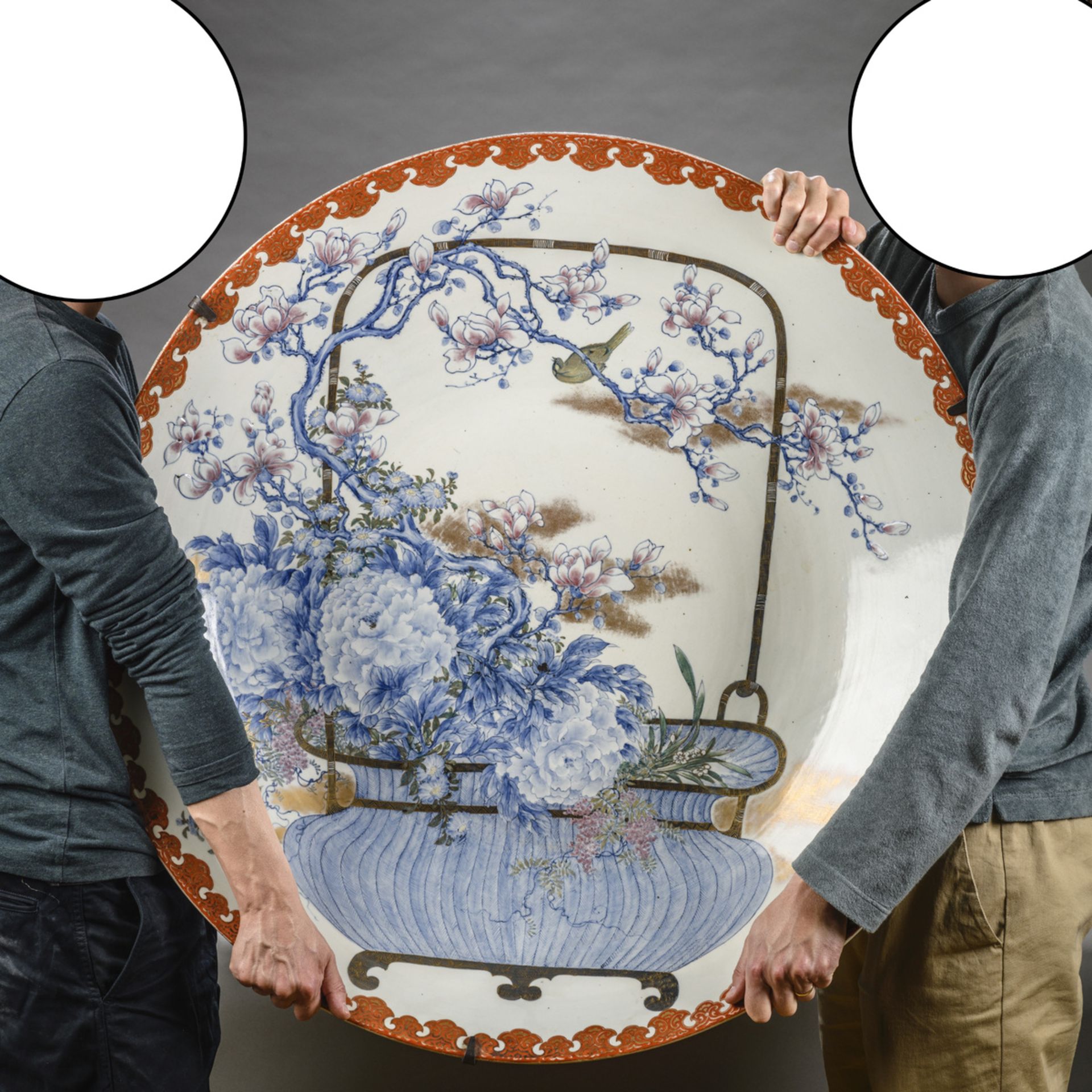 A very large Japanese porcelain plate 'flower basket', 19th century (dia 90cm)