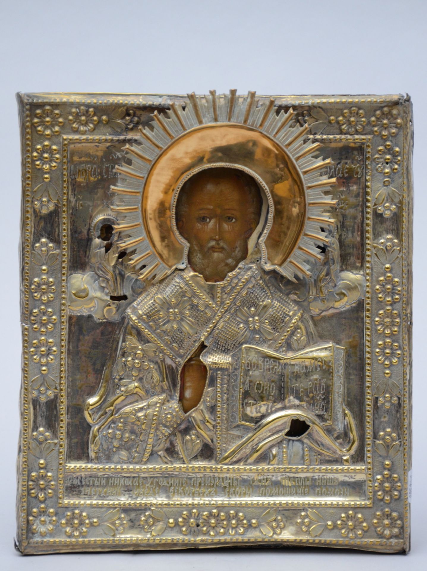 A Russian icon with metal riza (35x29cm) (*)