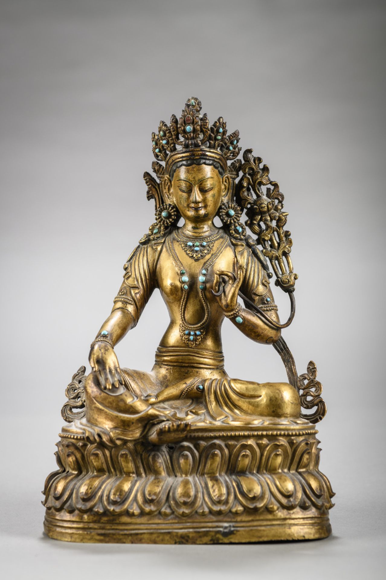 A Tibetan sculpture in copper repoussé 'green Tara', 18th century (h 27 cm)