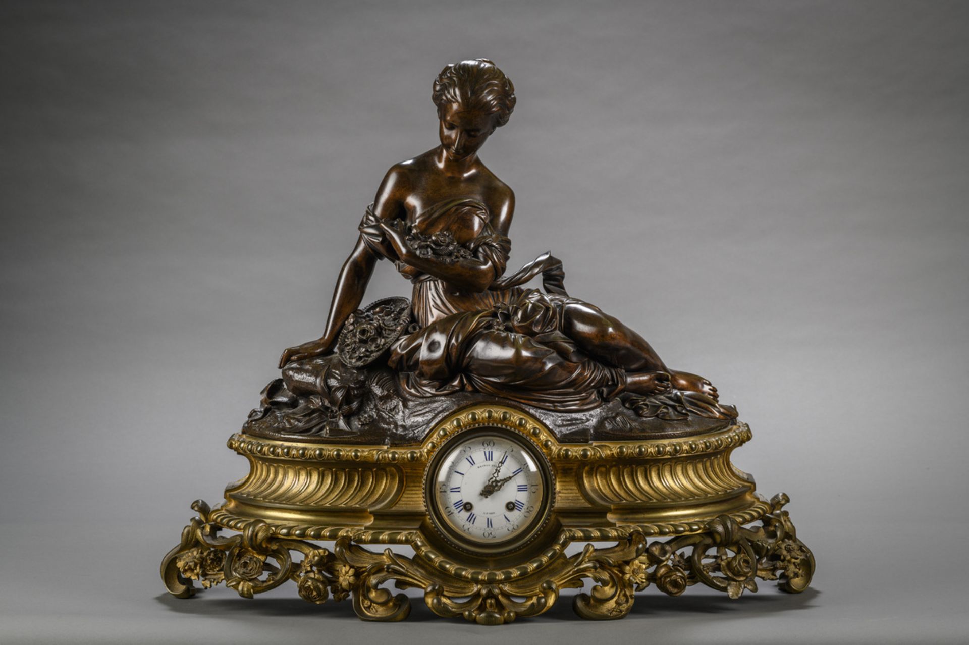 Large mantel clock in bronze 'resting lady', Raingo à Paris (59x72x24cm)