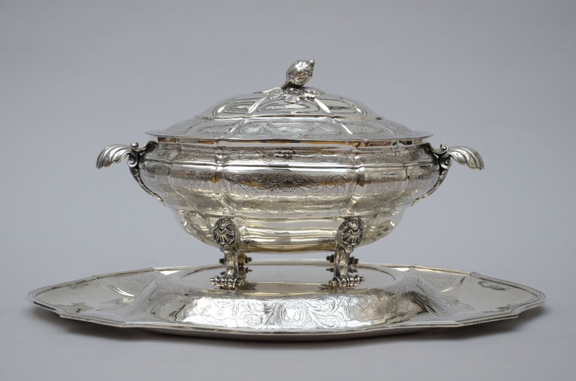 A fine engraved souptureen with plate