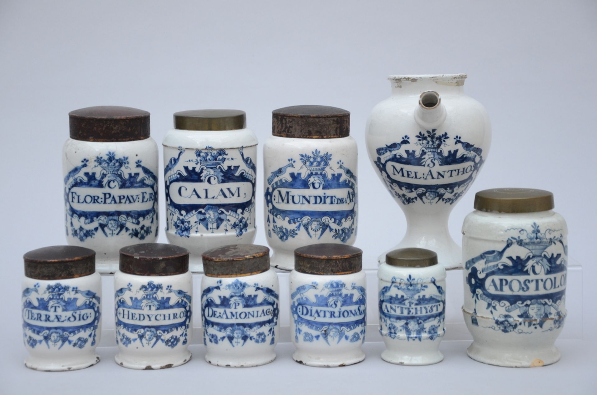 Nine apothecary jars and a bottle in faience, 18th century (h12/19/24cm)