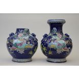A pair of large Chinese porcelain powder blue vases with famille rose decoration 'antiquities',