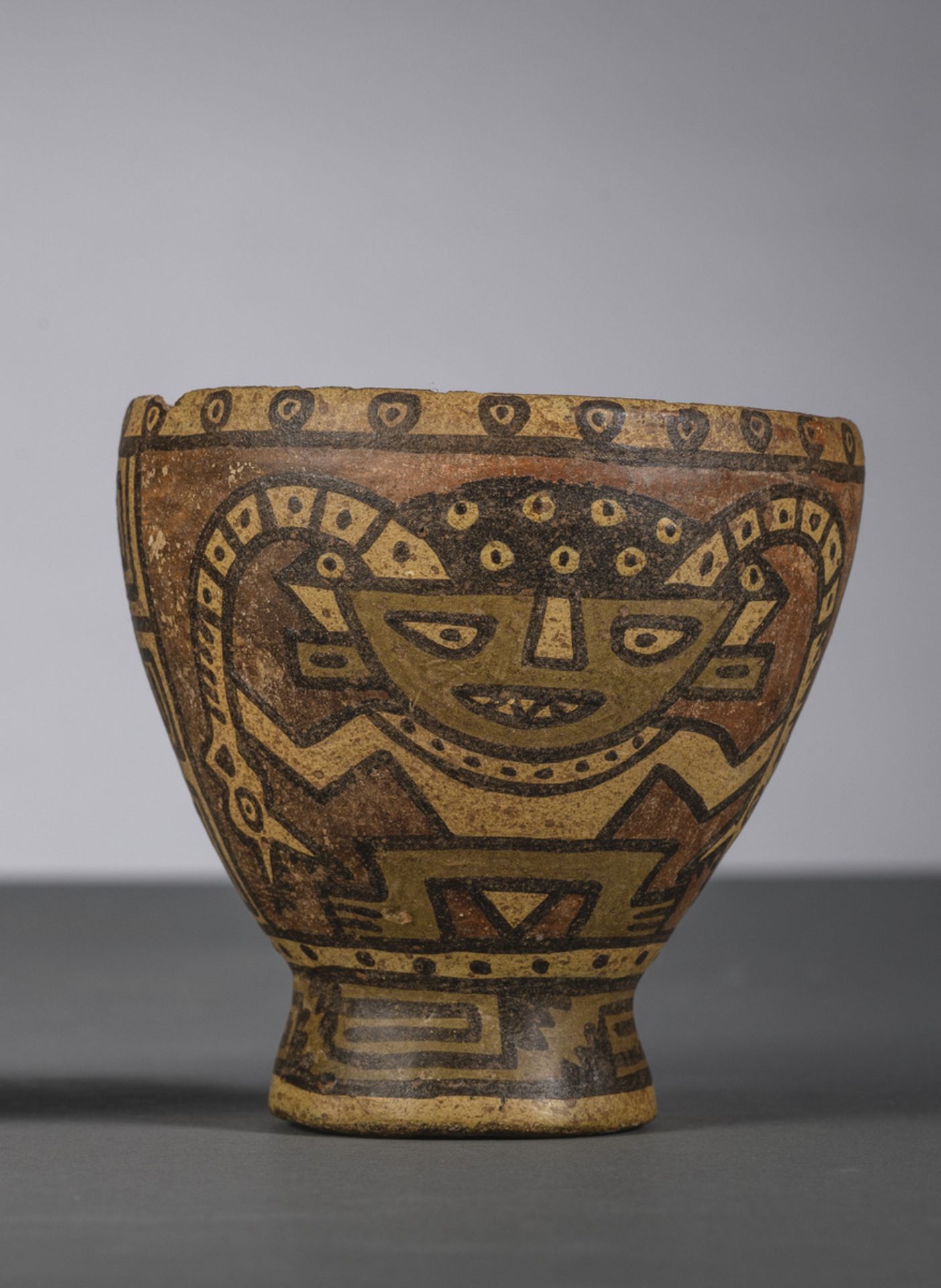 A pre-Columbian coupe 'character with snakes' (h11.50cm)