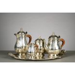 A four-piece silver coffee set on plate Delheid (from h13 to h26cm)