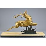 A French Art Deco Bronze Mantel Sculpture of a leaping stag on an alabaster and marble base,