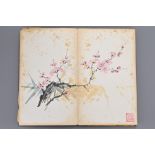 A Chinese accordion book of hand painted watercolours to include scenes of flowers, birds, fruit and