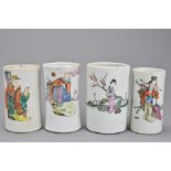 Four Chinese cylindrical porcelain pots. Each decorated with various figures. One with four-