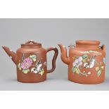 Two Chinese 19/20th century Yixing pottery teapots. Each decorated with enamel depicting birds and