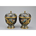 A pair of Chinese 19/20th Century cloisonnŽ enamel bronze boxes and covers each with dragons chasing