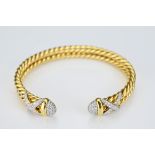 DAVID YURMAN yellow gold and diamond cable wrap cuff bracelet. Marked D.Y. 750. Diam. 6.4cm. Band