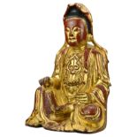 A Chinese red lacquer and gilt carved wooden seated Buddha. Height approx. 22.5 cm. Purchased in