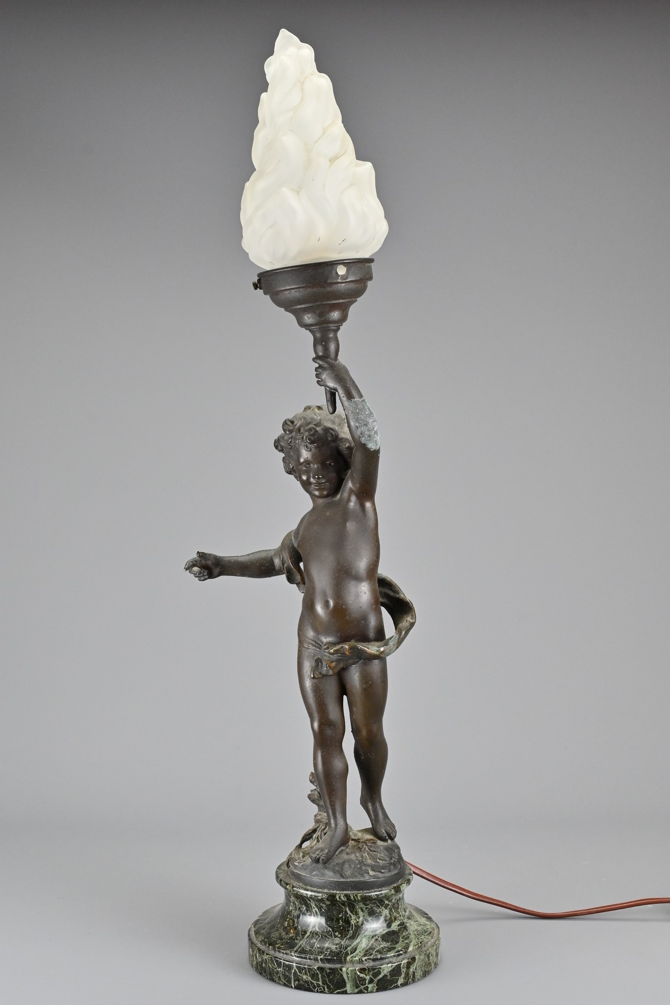 A 19th Century French Painted Spelter Table Lamp (after Auguste Moreau), depicting putti carrying