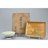 A Japanese gilt lacquer rectangular tray in low relief depicting landscape scene on four L-shaped