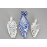 Three Bristol Nailsea Glass Flasks, 19th Century, one clear glass decorated with white trailing, one