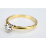 An 18ct diamond solitaire ring. Ring stamped 750. Ring size O/P. Diamond approx. 0.4ct. Weight 2.6