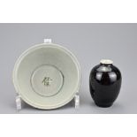 A Chinese Ming dynasty blue and white porcelain bowl together with a black glazed jar. Bowl 12.5cm