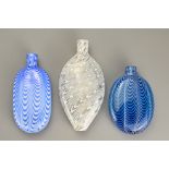 Three Bristol Nailsea Glass Flasks, 19th Century, one in blue glass decorated with white trailing,