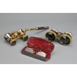 A pair of vintage field and marine day and night achromatic binoculars, together with a pair of