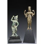 Two Southeast Asian bronze figures. One four-armed figure dressed in sampot holding Buddhist emblems